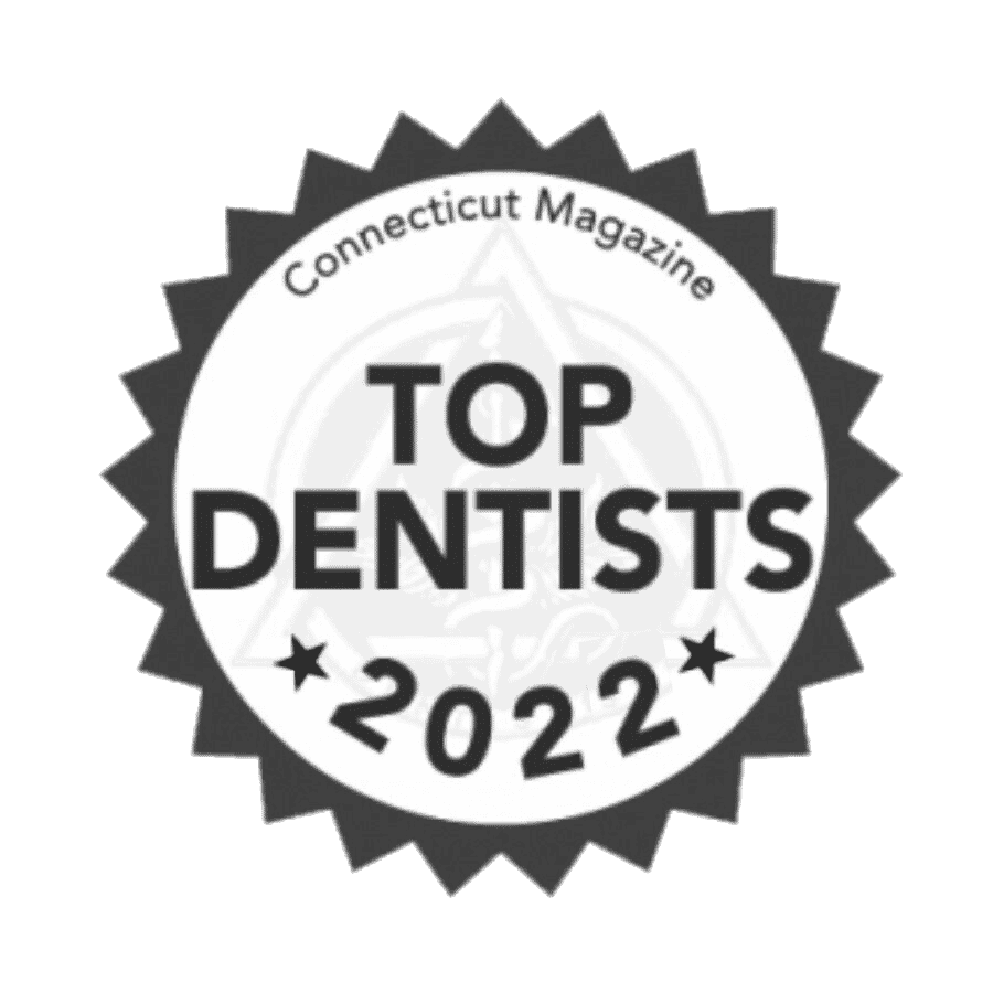 Text says "Connecticut Magazine Top Dentists 2022" inside a sunburst