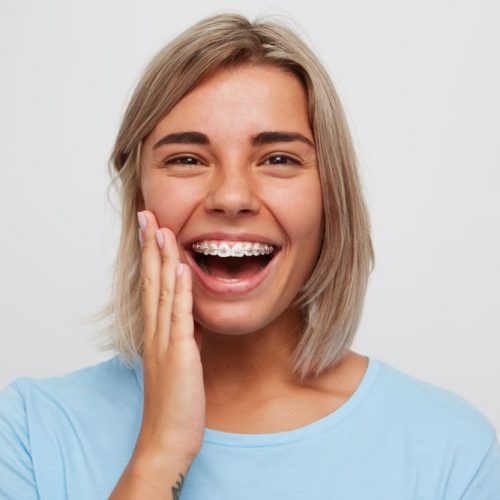 Cheerful,Beautiful,Young,Woman,With,Blonde,Hair,And,Braces,On